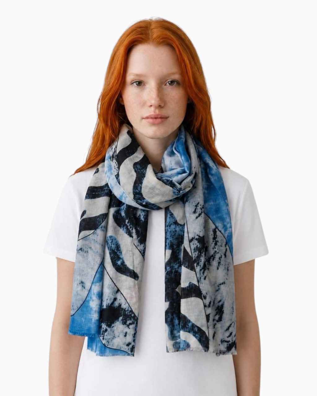 Thrift N Gift lightweight abstract print scarf in blue, white, and charcoal with frayed edges worn by a model.
