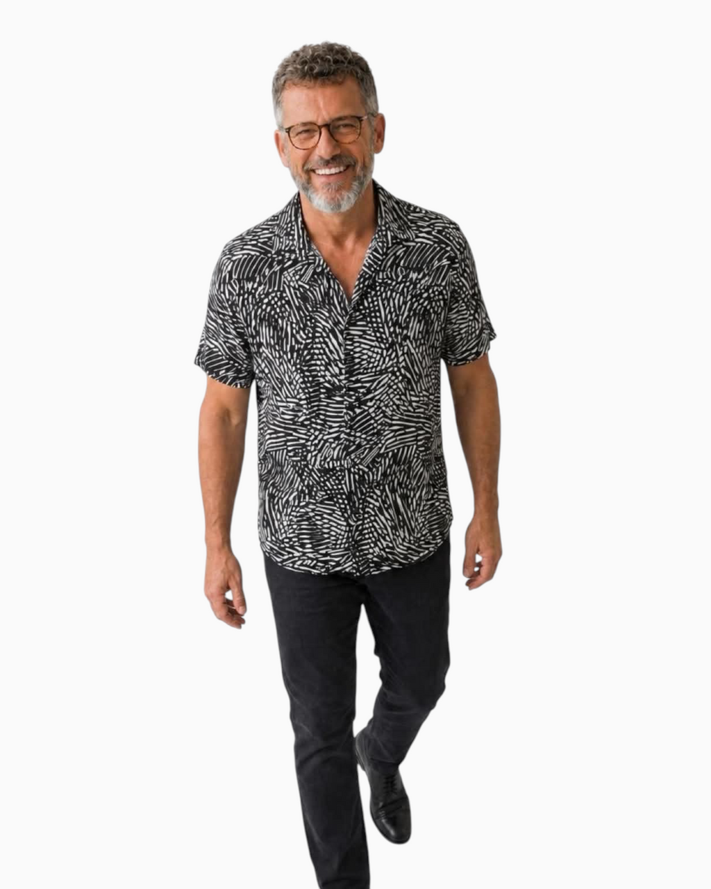 Thrift N Gift men's short sleeve button-down shirt with a black and white abstract print worn by a smiling man