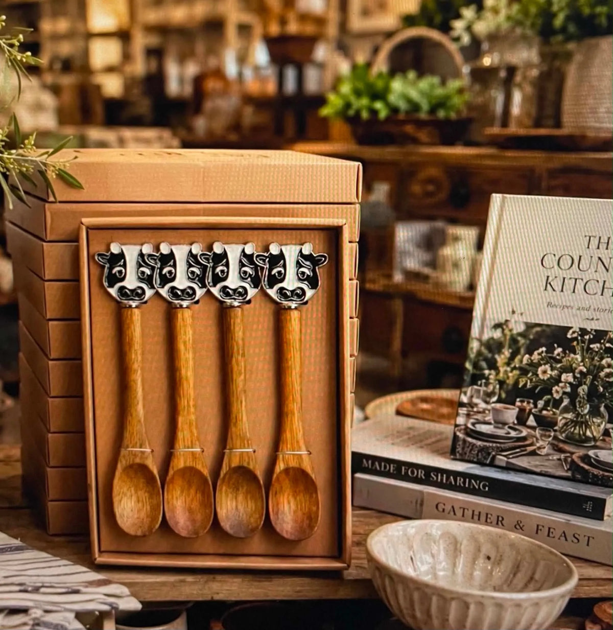 Thrift N Gift set of 4 acacia wood spoons with decorative black and white cow handles in a gift box