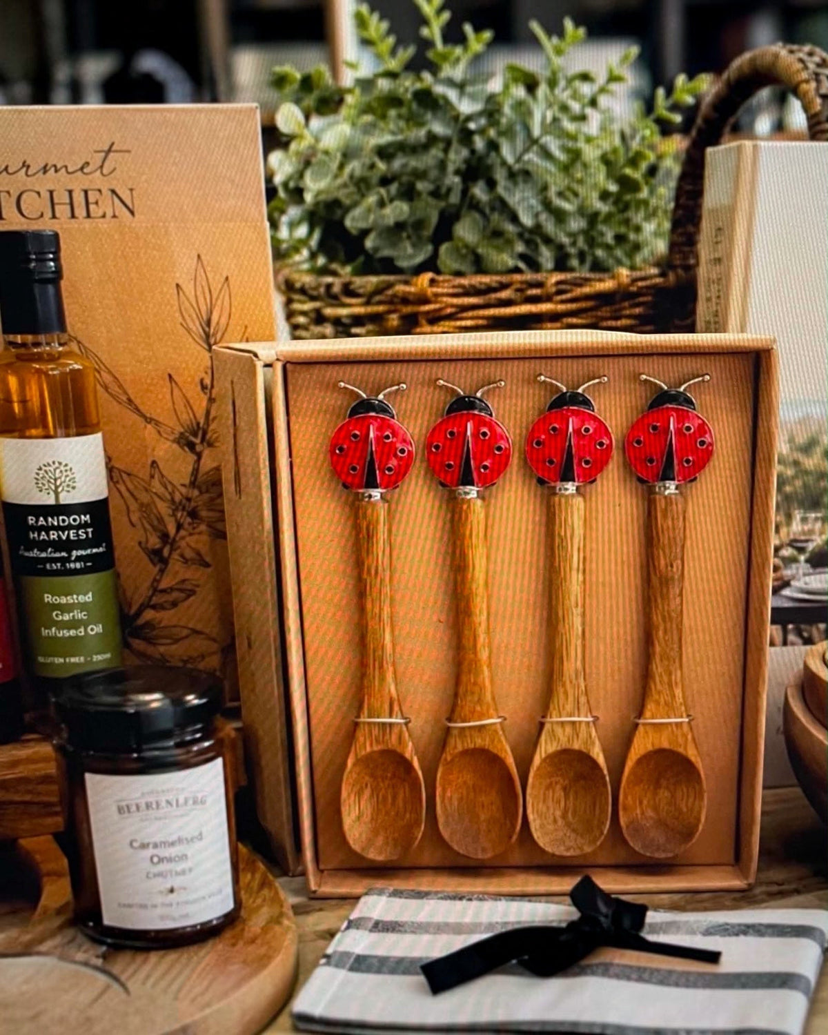 Thrift N Gift set of four acacia wood spoons with decorative red lady beetle handles in a gift box