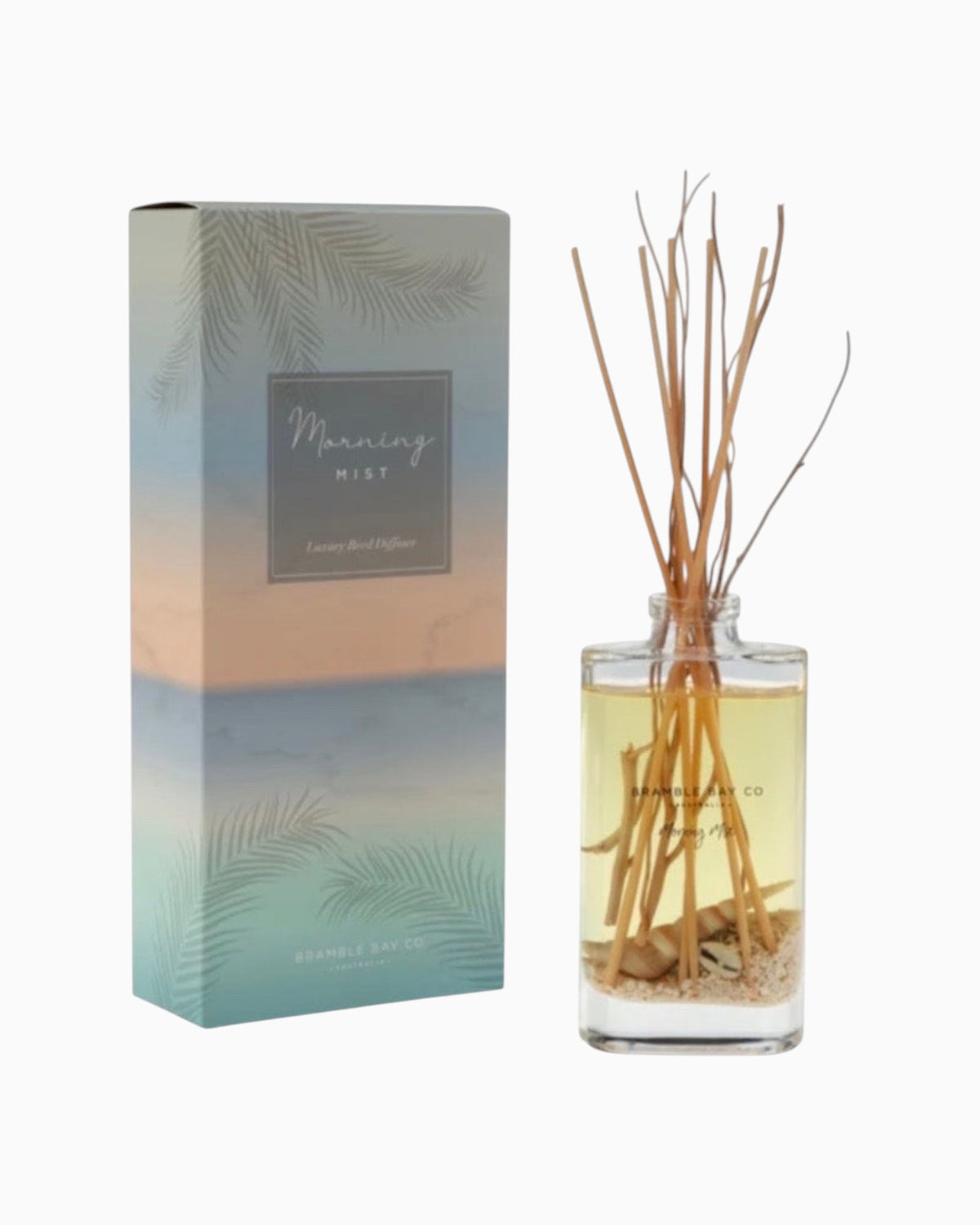Thrift N Gift Bramble Bay Morning Mist reed diffuser with glass vessel, natural sand, seashells, and willow sticks.
