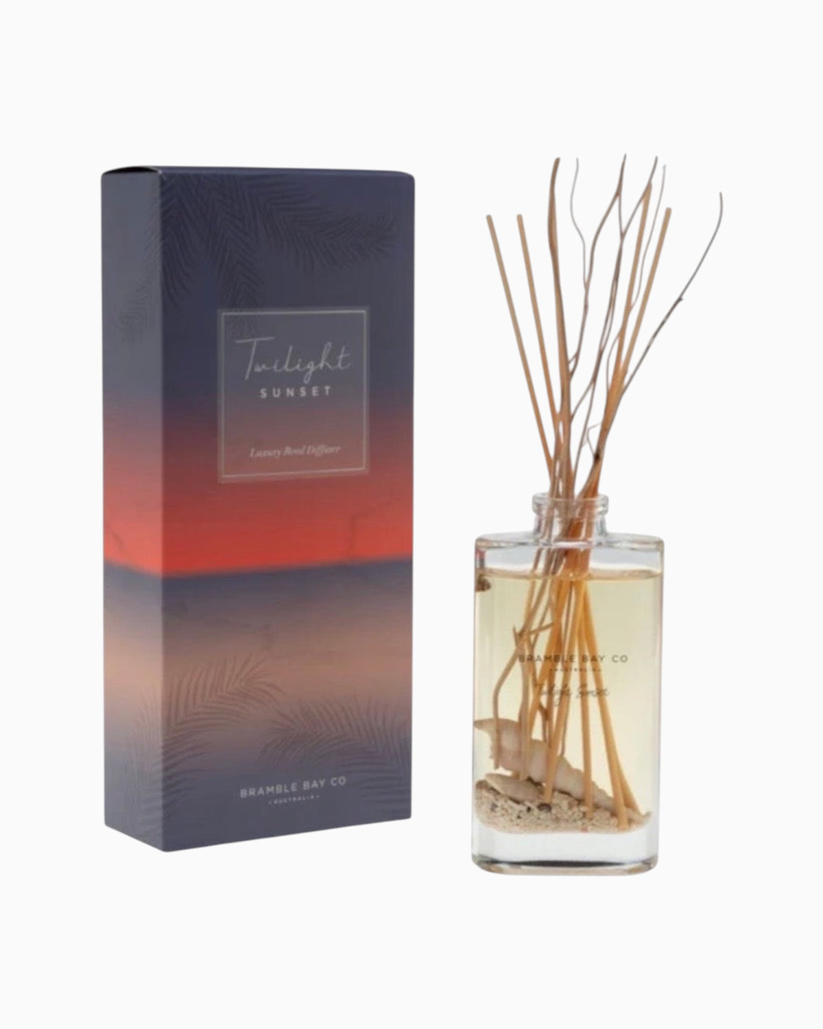 Thrift N Gift Bramble Bay Twilight Sunset reed diffuser with glass vessel, natural sand, seashells, and willow sticks.