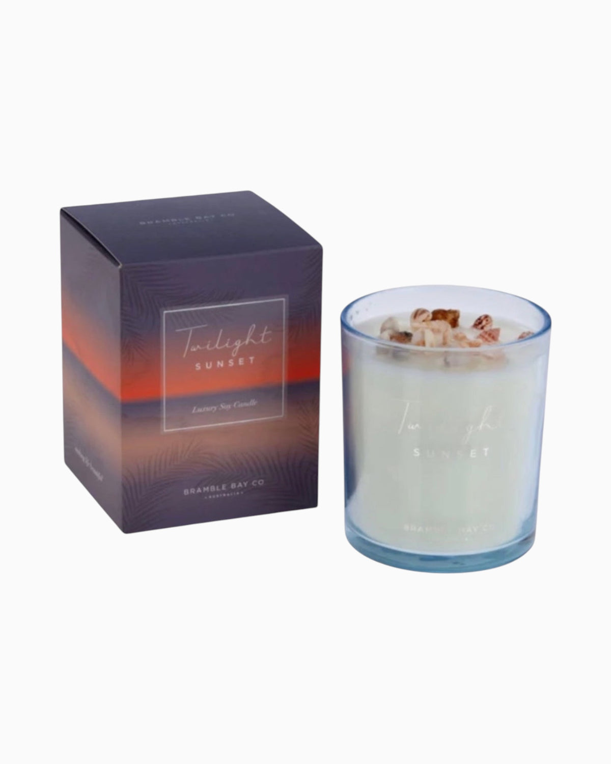 Thrift N Gift Bramble Bay Twilight Sunset soy candle in a blue glass jar topped with authentic sea shells