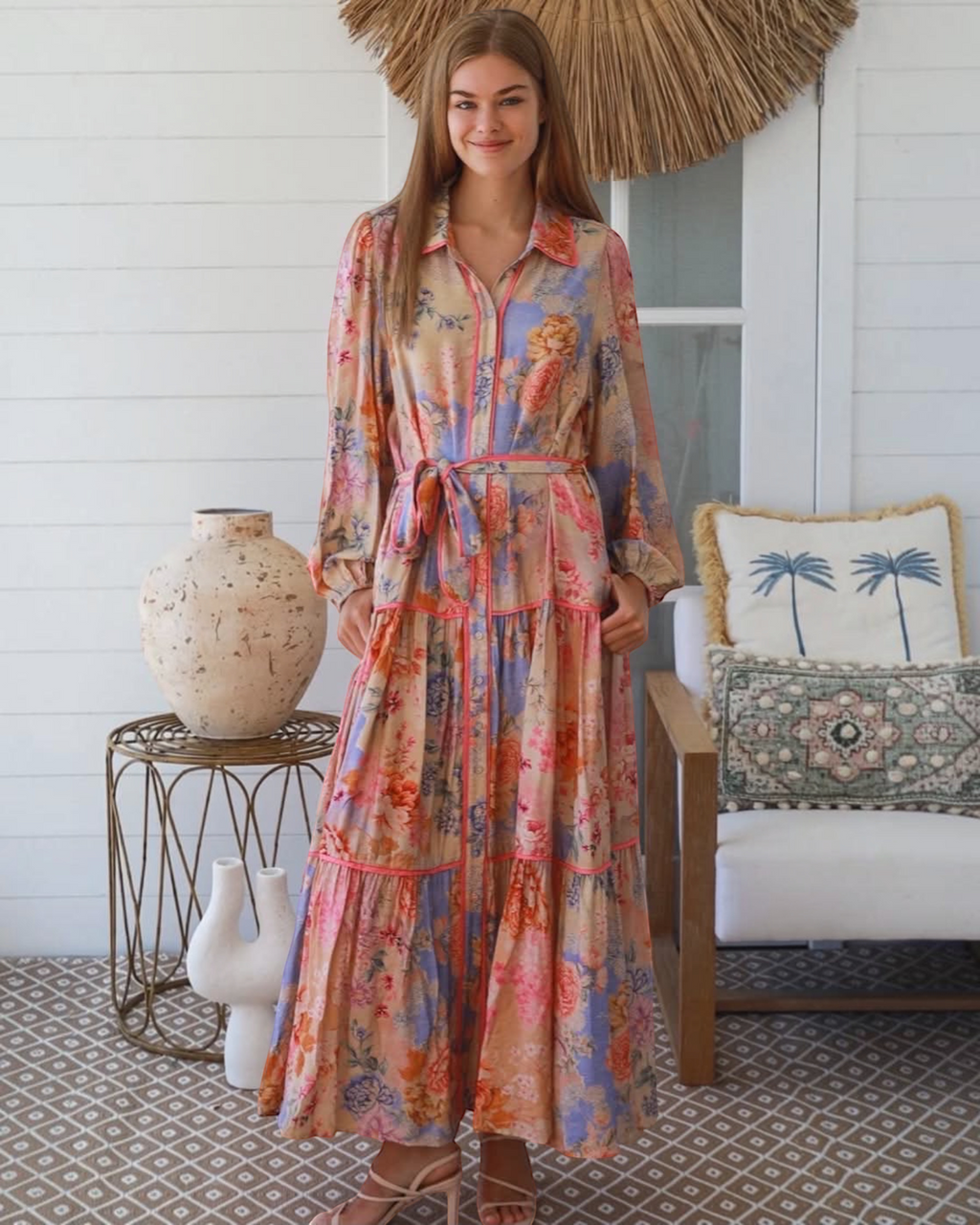 Thrift N Gift floral print button down maxi dress with tiered skirt, long sleeves, and waist tie in warm pastel hues.