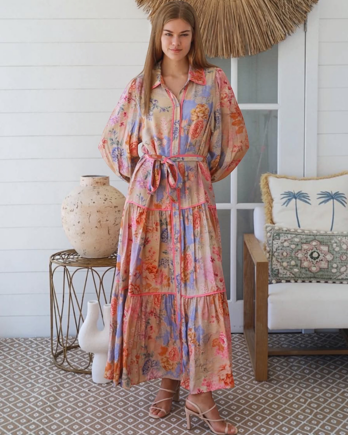 Thrift N Gift floral print button-down maxi dress with long sleeves, tiered skirt, and waist tie on a female model.