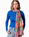Thrift N Gift lightweight floral scarf in pink, orange, and green worn knotted around the neck by a woman