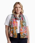 Thrift N Gift sage green floral scarf with pink blossoms and amber branches worn by a woman in a white t-shirt