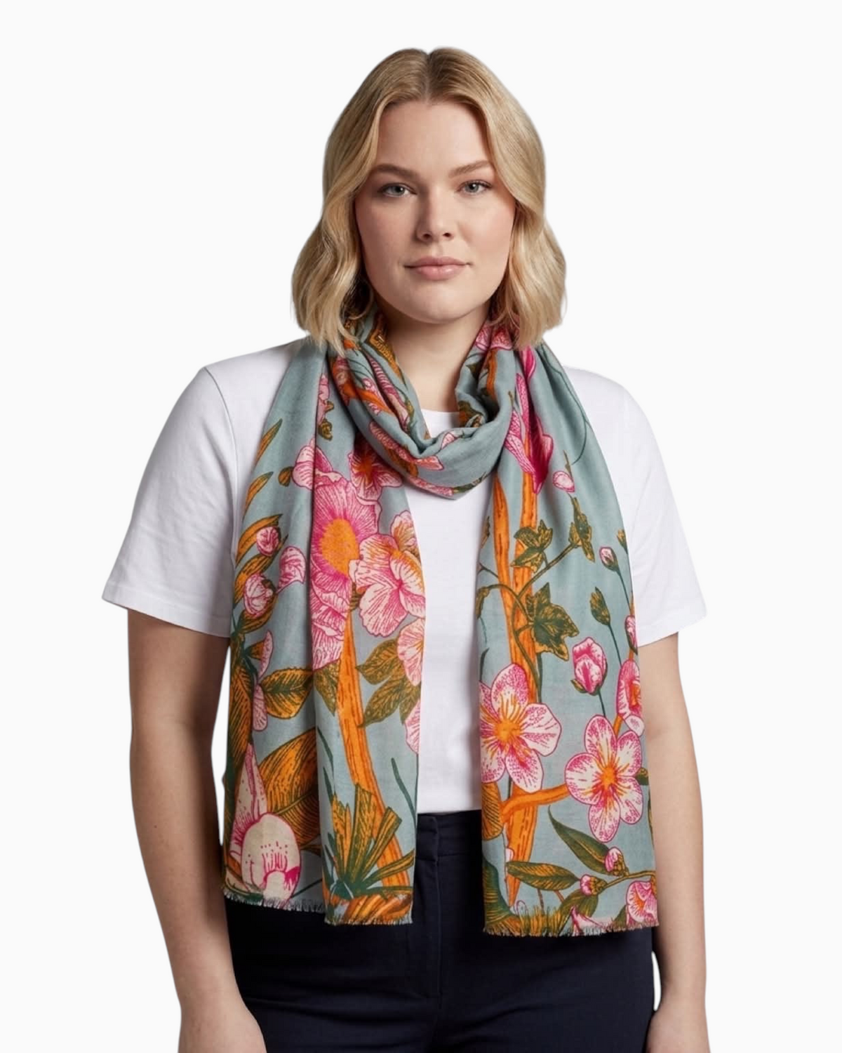 Thrift N Gift sage green floral scarf with pink blossoms and amber branches worn by a woman in a white t-shirt
