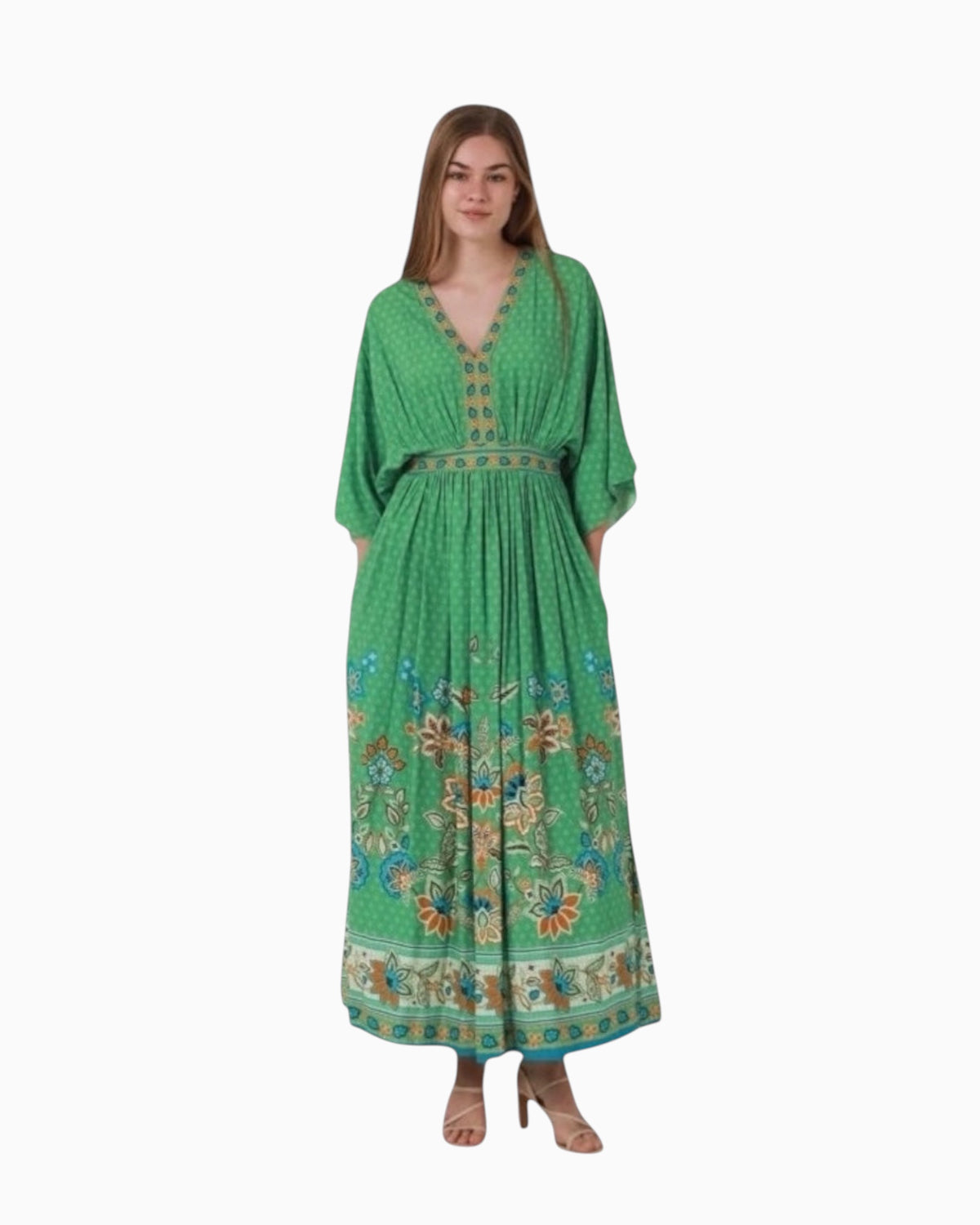 Model wearing a green paisley print Thrift N Gift Dreamcatcher boho maxi dress with a V-neckline and silky fabric.