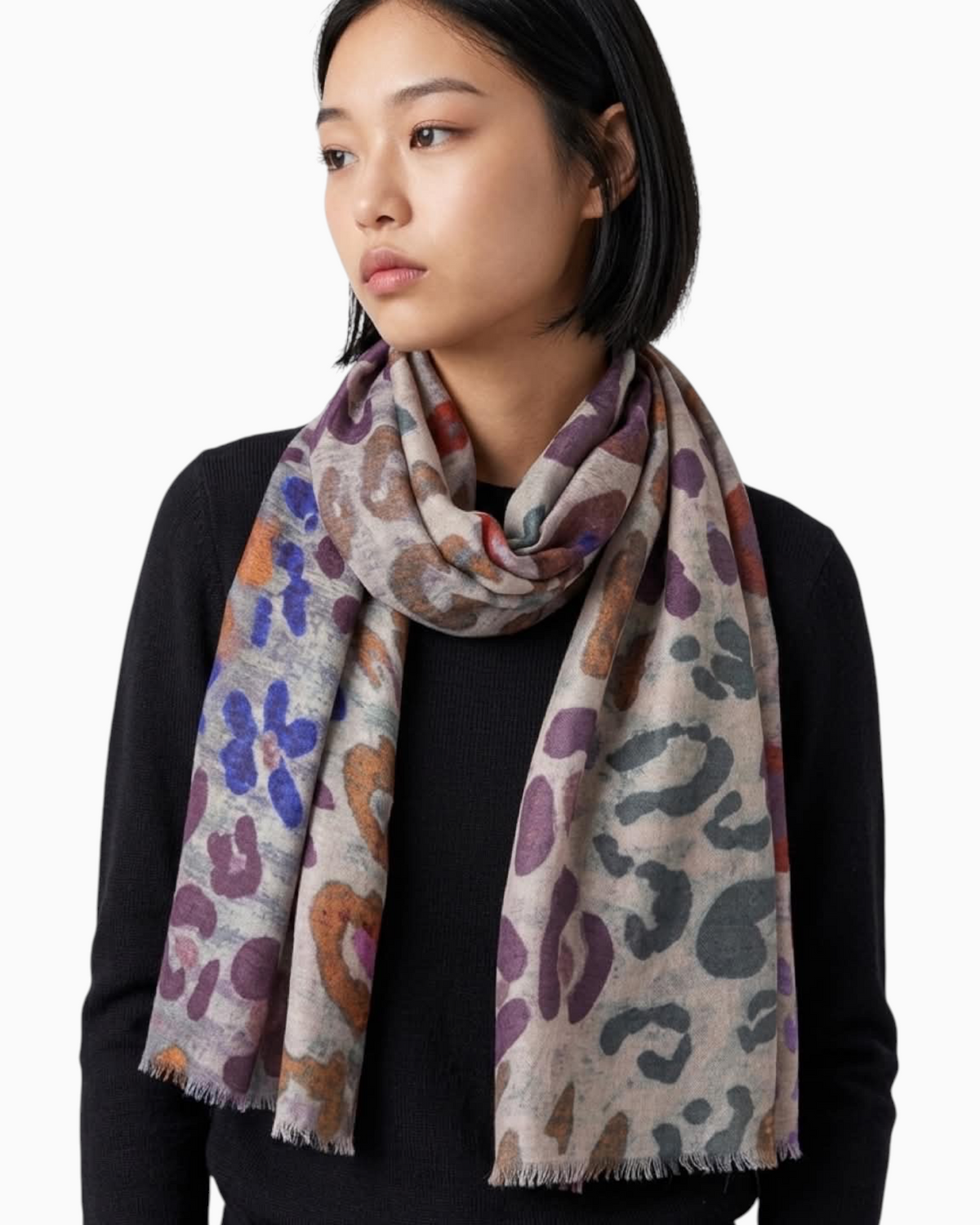 Thrift N Gift lightweight scarf featuring a multi-colored leopard print with purple and blue accents and frayed edges.