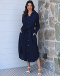 Thrift N Gift navy blue midi shirt dress with a collar, button-down front, tie-waist, and pockets on a smiling model.
