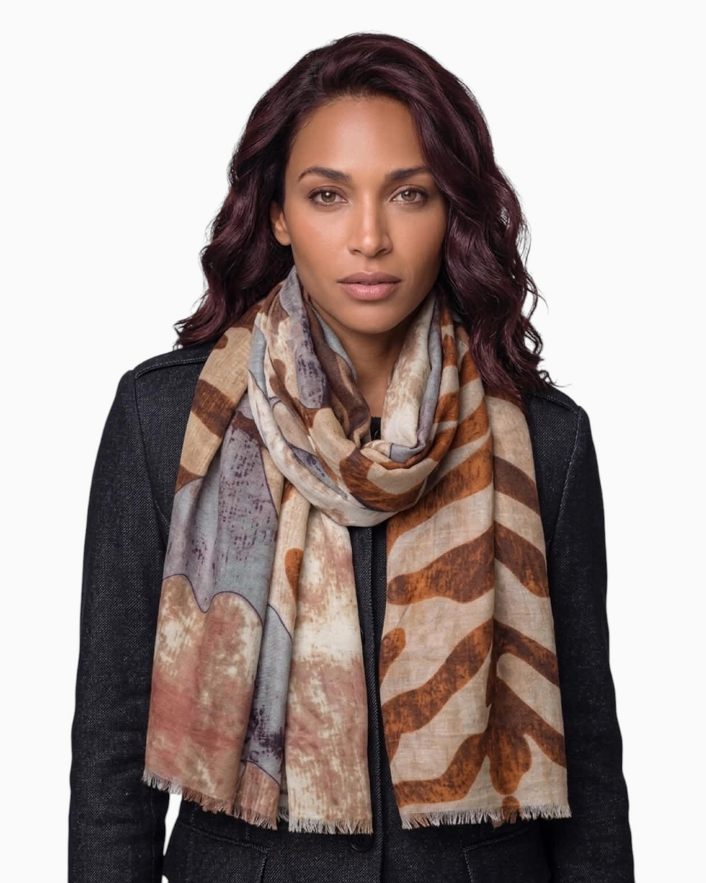 Thrift N Gift lightweight printed scarf in earth tones with abstract patterns and frayed edges worn by a woman