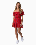 Model wearing a Thrift N Gift red floral off-the-shoulder mini dress with a ruffled neckline and tiered skirt.