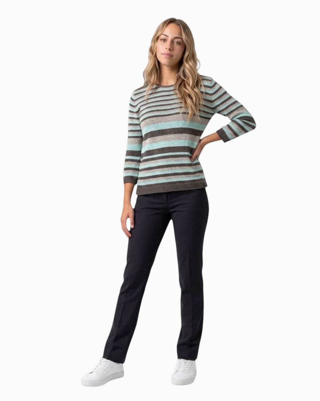 Thrift N Gift striped knit sweater with three-quarter sleeves in brown, beige, and aqua blue worn with black trousers.